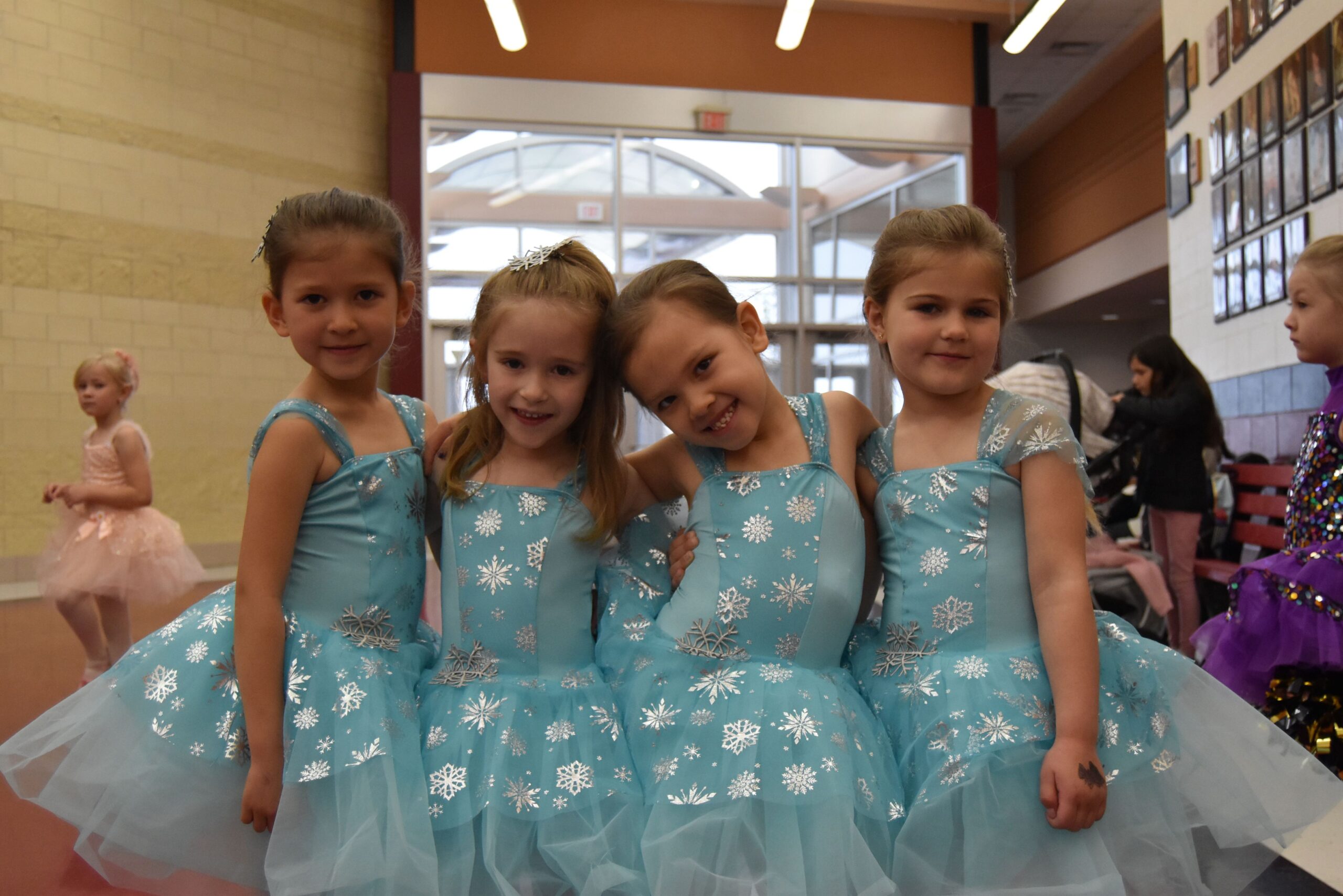 Four girls in their dance recital costumes